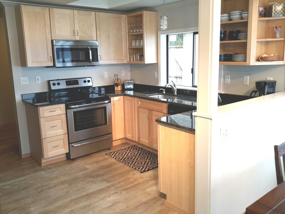 Granite Countertops, stainless appliances and Maple cabinets
