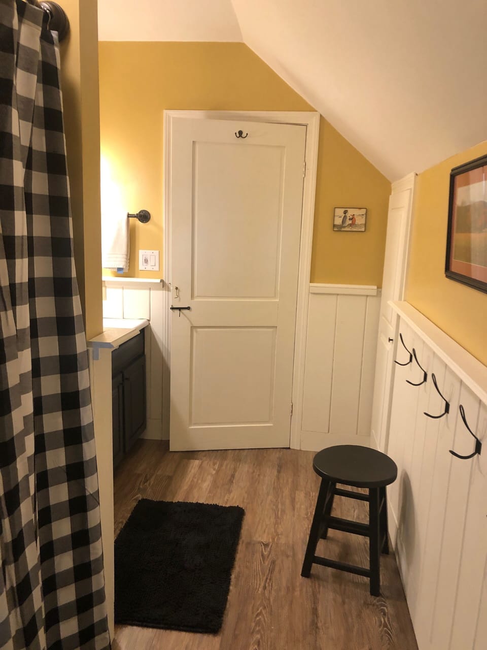 The recently updated upstairs bathroom has a stall shower
