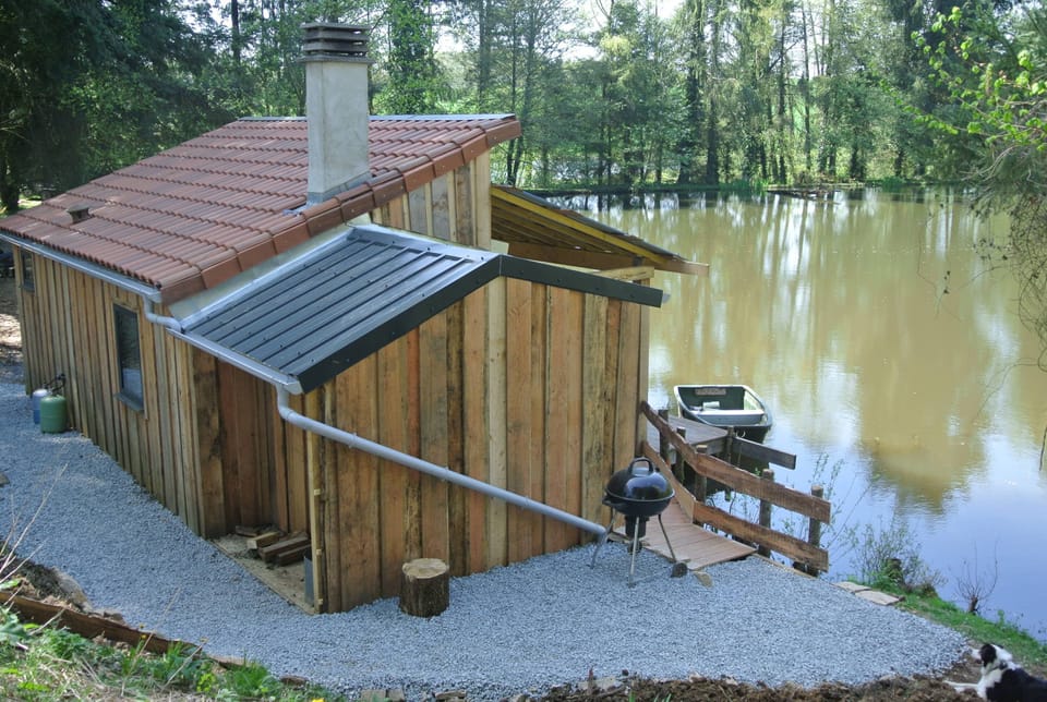 BBQ area and side of cabin