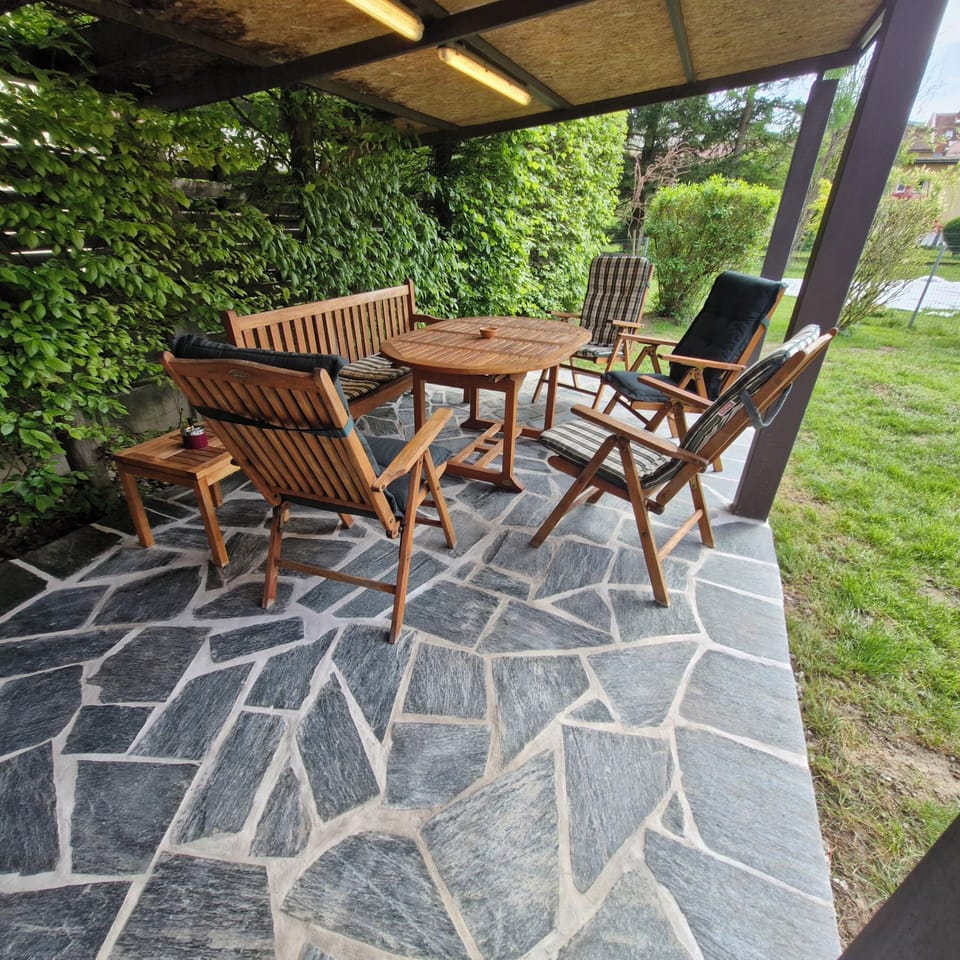 Covered terrace - wooden patio furniture with comfortable pillows