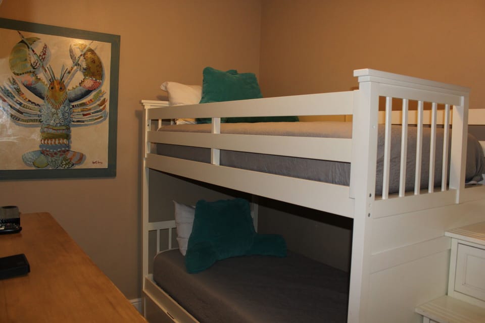 The bunk bed has safety in mind with railings and a stairs. 