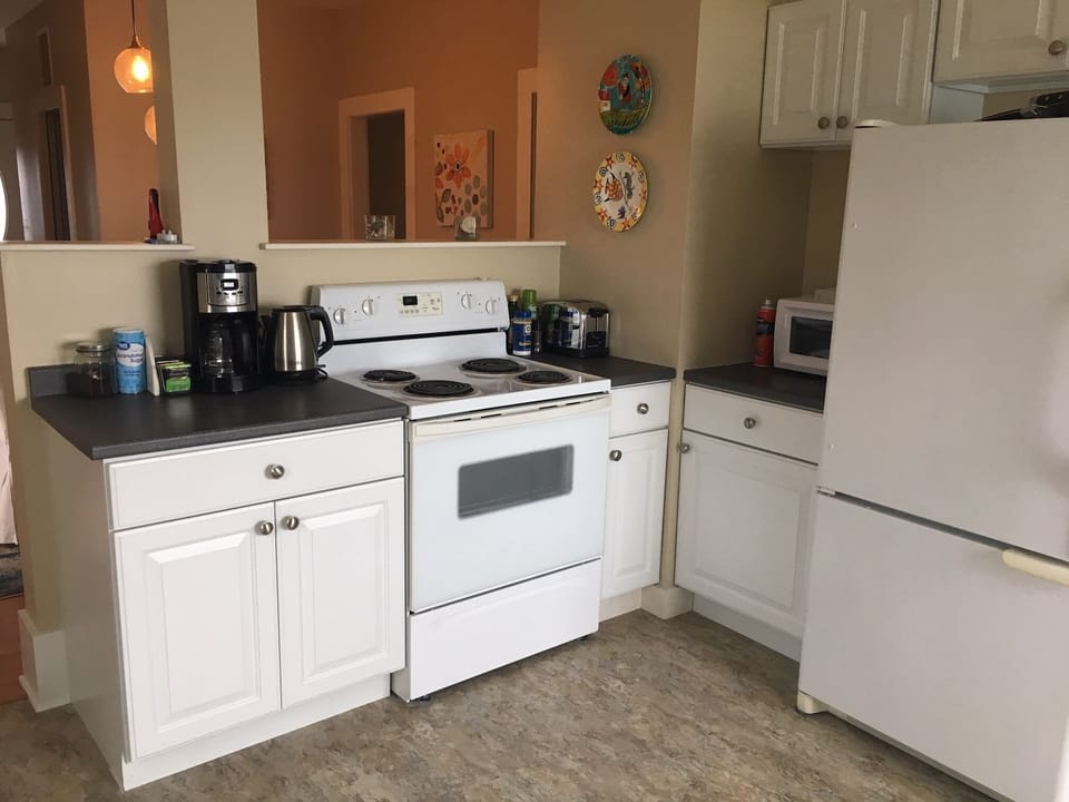Well equipped kitchen, electric range, coffee maker, toaster, microwave.