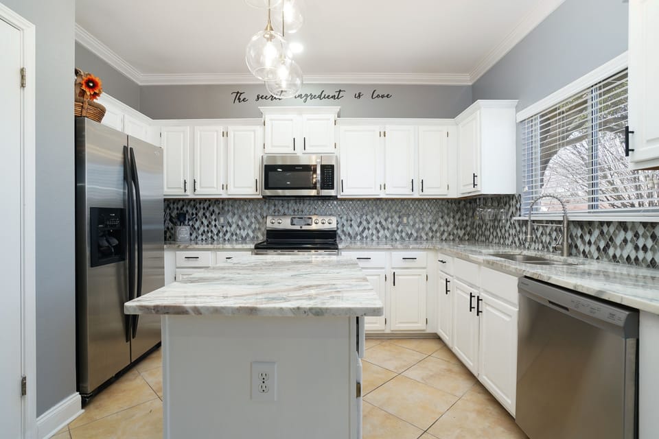 Open concept kitchen, perfect for gathering and socializing. 
