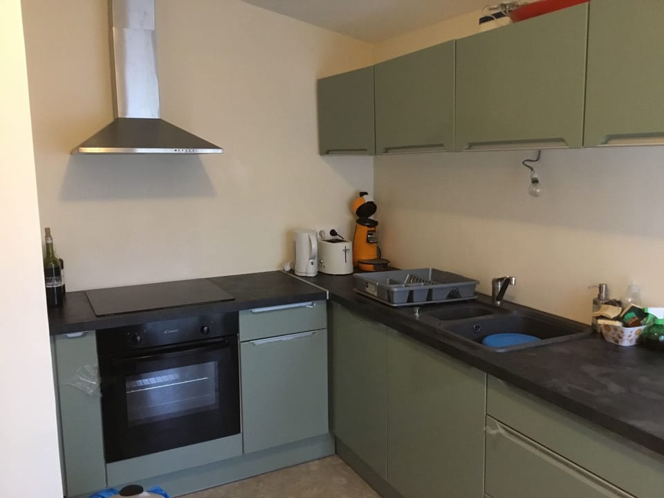 Kitchen with electric stove and oven