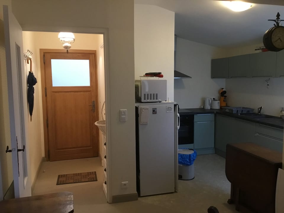 Entry hallway and view of kitchen