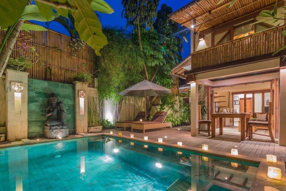 Private pool area with beautiful night lighting
