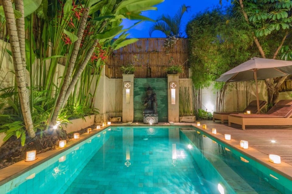 Private pool area with beautiful night lighting