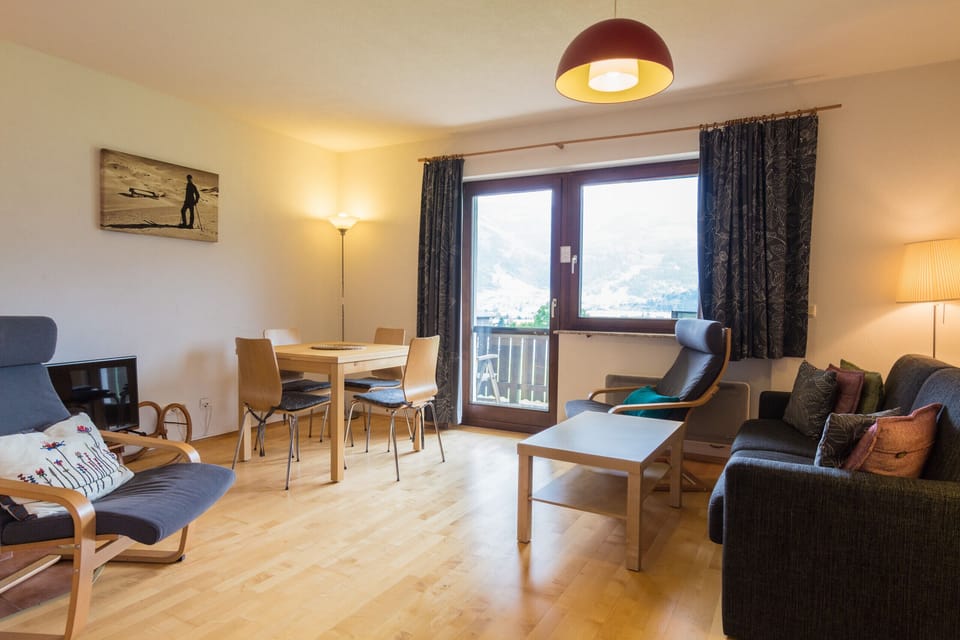 Living room of Mountain View apartment Kaprun looking out to balcony