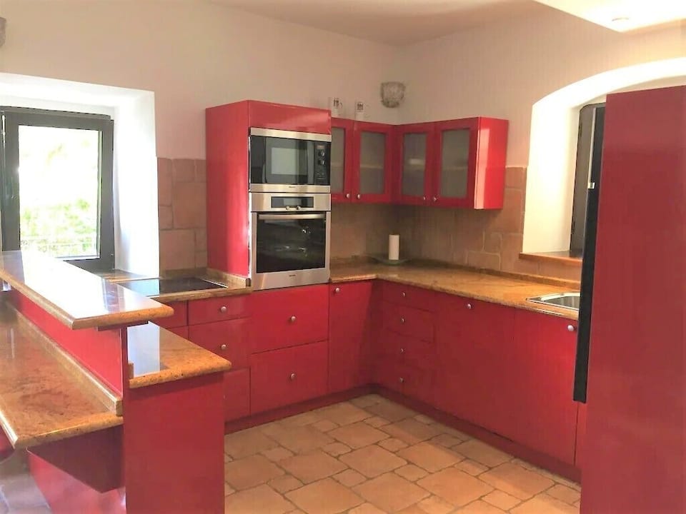 The Kitchen is equipped with Miele appliances: oven, microwave, hob...