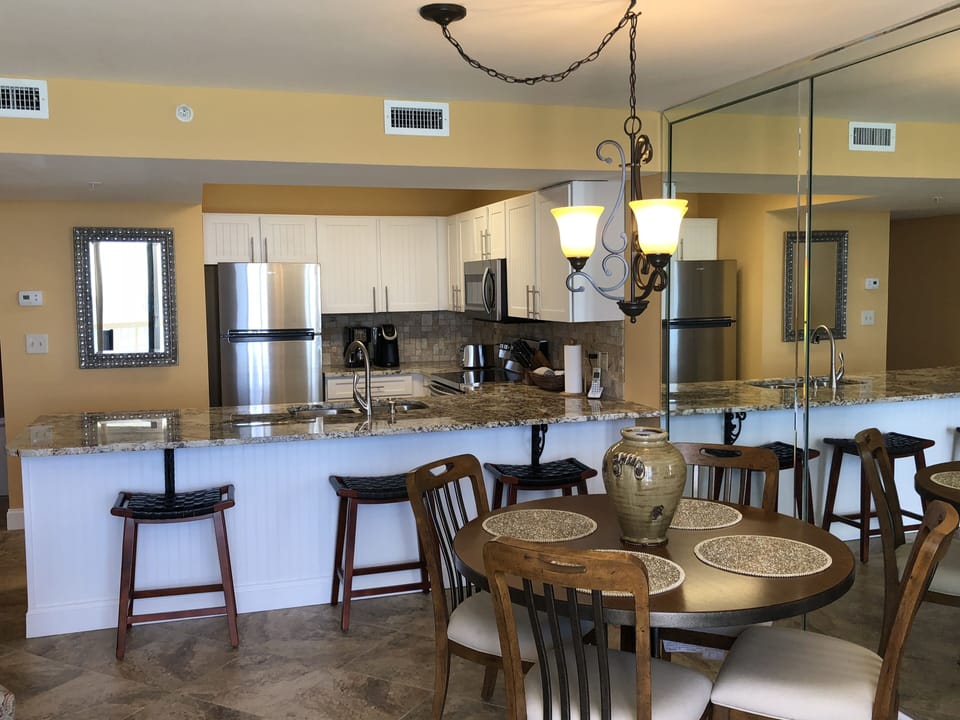 Dining table and kitchen area