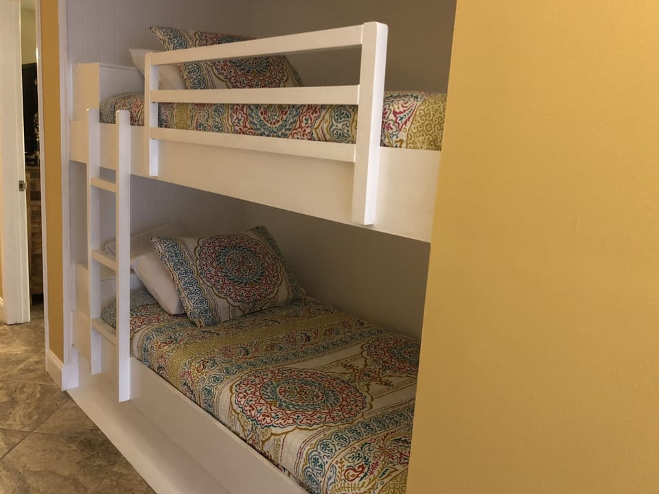 Bunks in hallway, all fresh new bedding