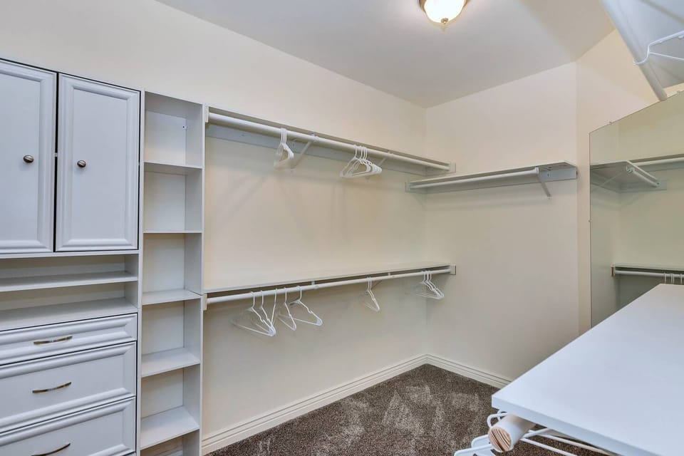 Another walk in closet for the Big Room;  plenty of space to store all your clothes and outfits. We have extra blankets, hangers for your towels, and a blow up mattress for you in this closet.