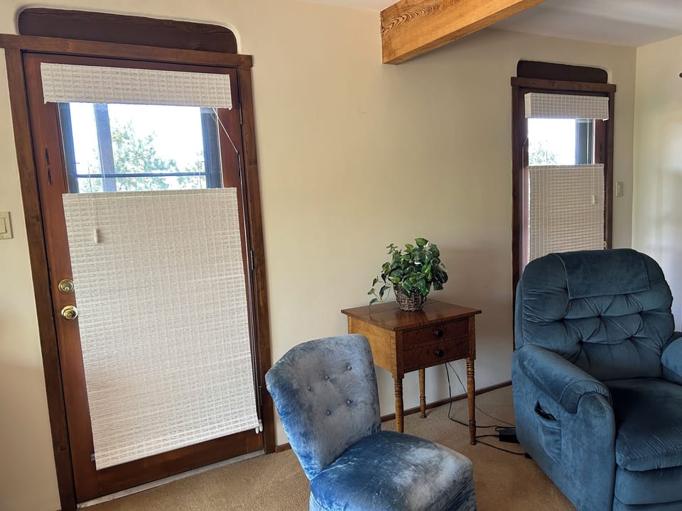 Double doors leading to balcony off Master bedroom - note beam in ceiling