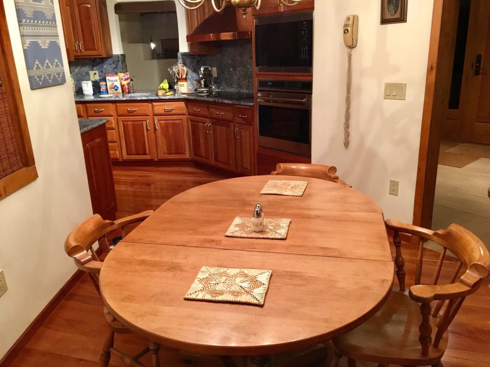 Eating area off kitchen seats six.  Taken from built in computer desk on side