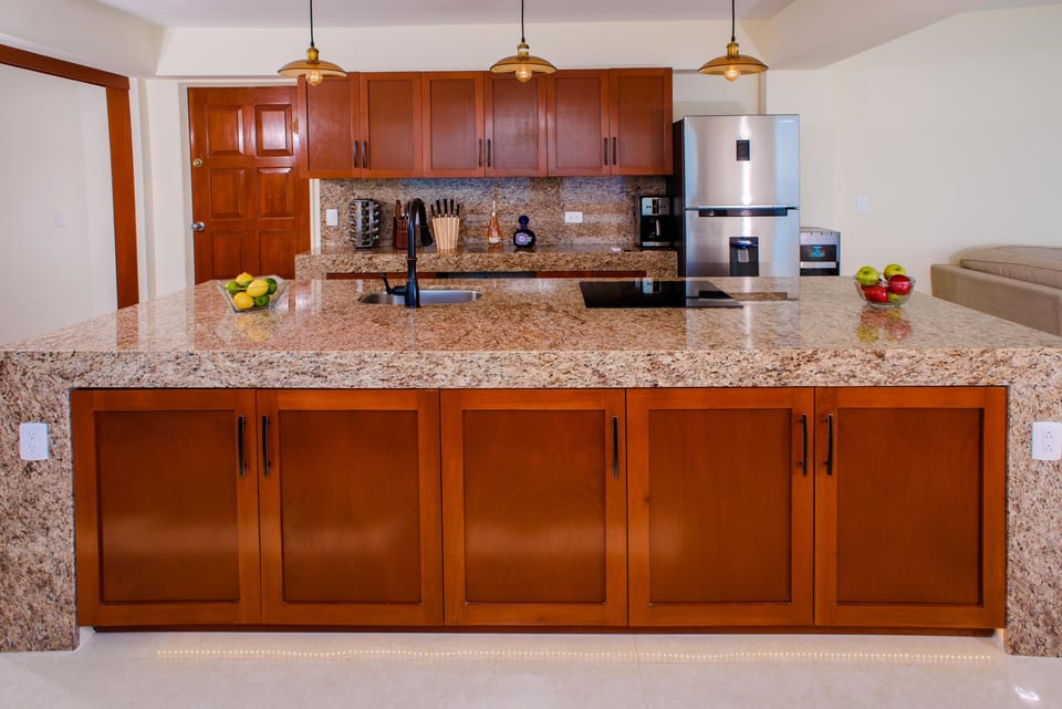 Fully equipped kitchen including stovetop, oven, full size fridge, pots/pans..