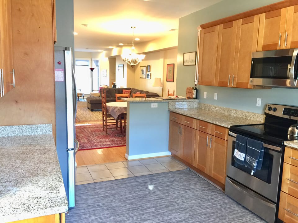 Kitchen with electric appliances, microwave, dishwasher, etc.  
