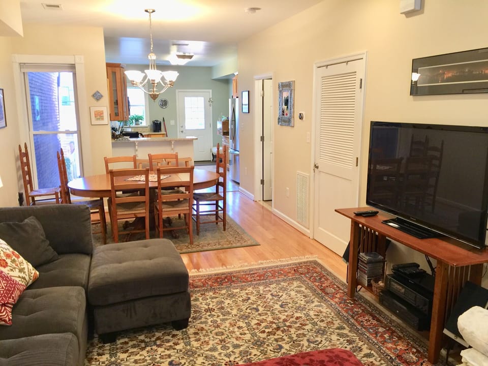 Living room with 55 inch flat screen TV with Amazon and Sling TV for movies, etc