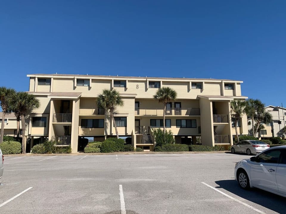 Front of the building. The unit is on the first floor far left. There are 12 steps.