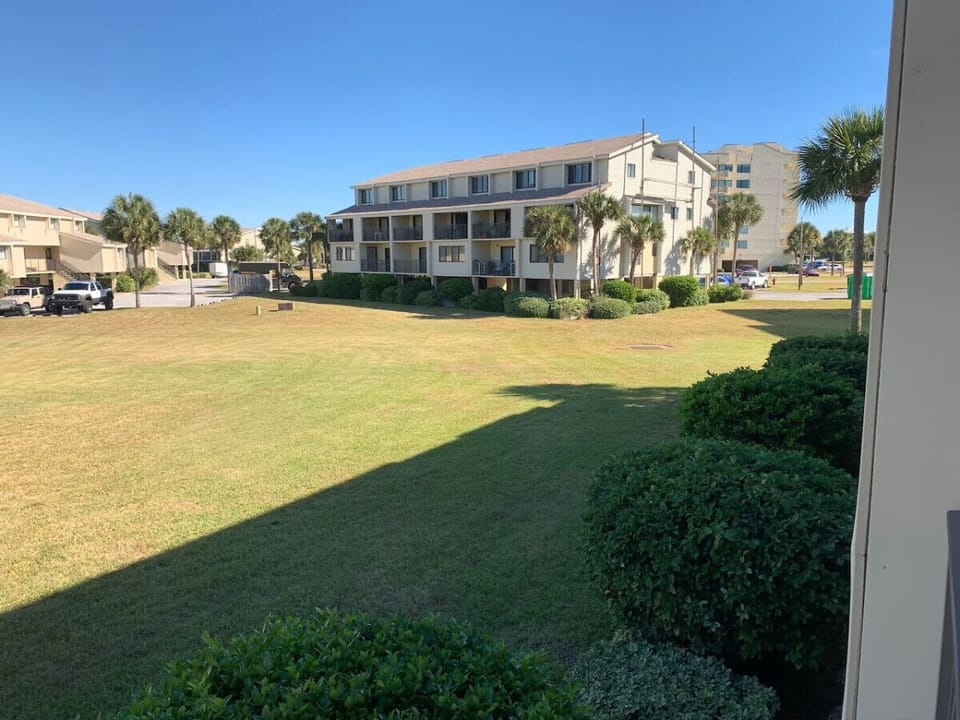 Another view from the balcony shows the large grassy area.