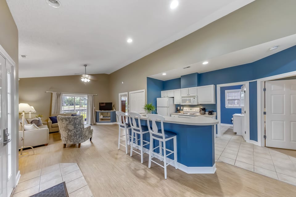 Kitchen and Counter Area with Bar Stools