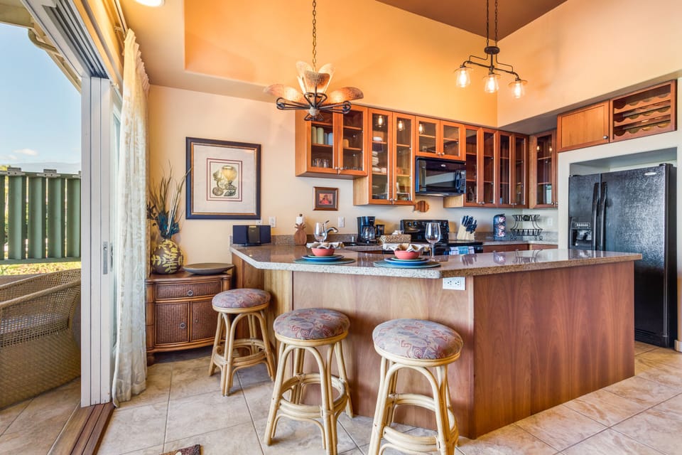 Very well appointed kitchen that opens to ocean views off the lanai.