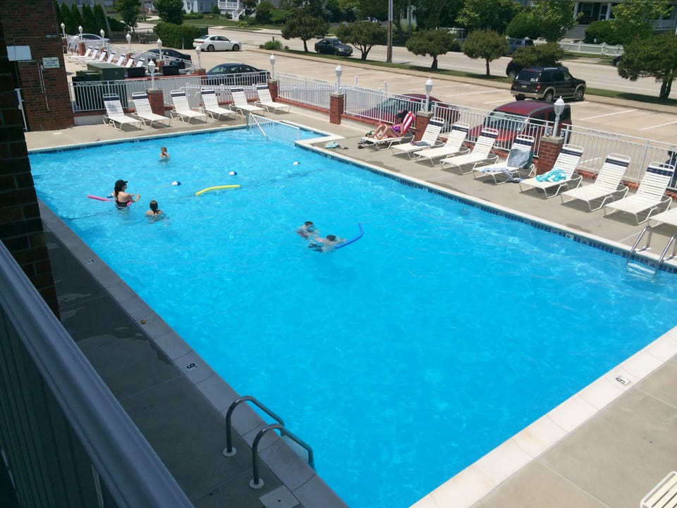 Steps to Heated Adult and Kiddie Pools with Lounge Chairs to Soak Up the Sun!