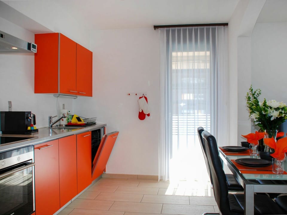 Building, Cabinetry, Window, Orange, Wood, Kitchen Appliance, Plant, Kitchen Stove, Houseplant, Kitchen