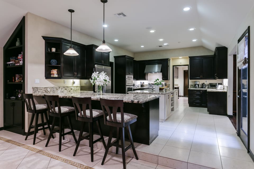 Beautiful, large open kitchen with bar stool seating for four.