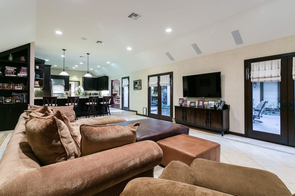Shelf with games and books. View toward kitchen.  Open space floor plan!