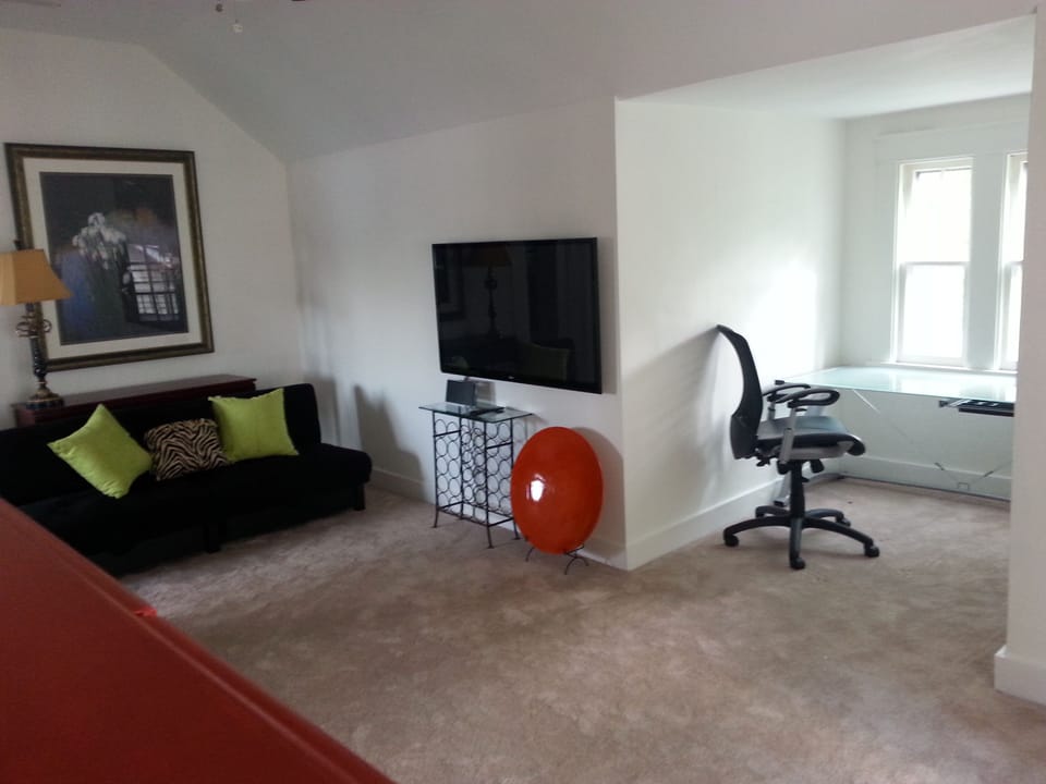 living room with office alcove