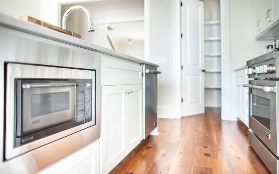 The kitchen comes fully equipped with microwave, dishwasher, and range.