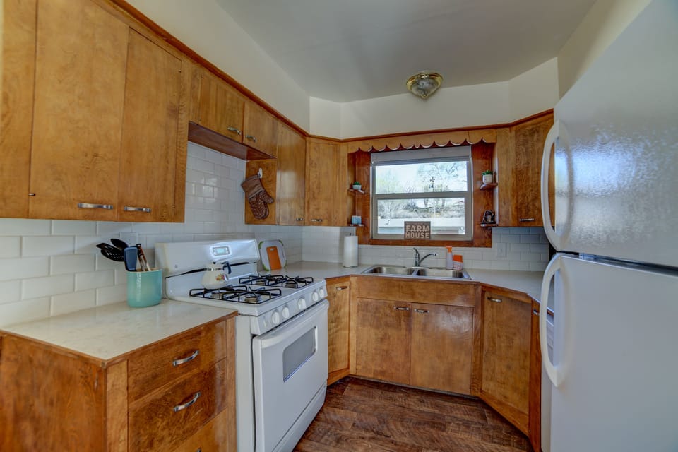 Quaint farmhouse kitchen is well equipped with gas range.