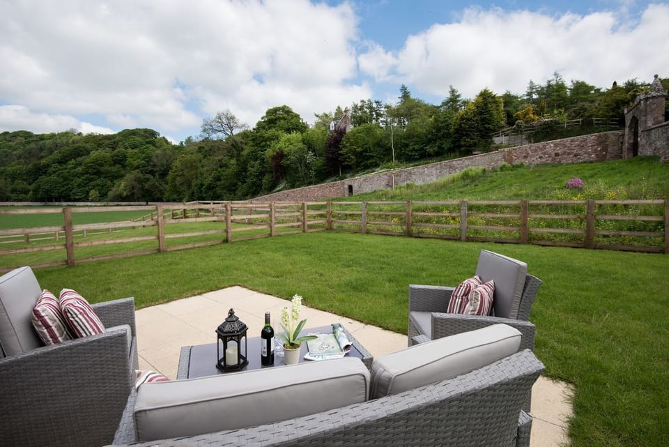 Dryburgh Stirling One - rear garden with rattan garden furniture