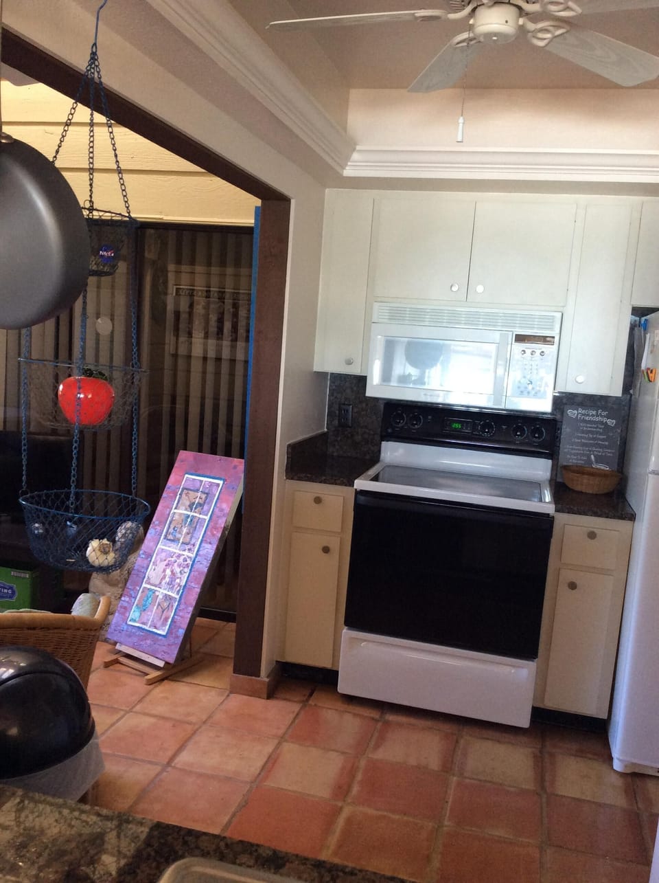 partial kitchen, bonus room with deck and slider from main floor master bedroom