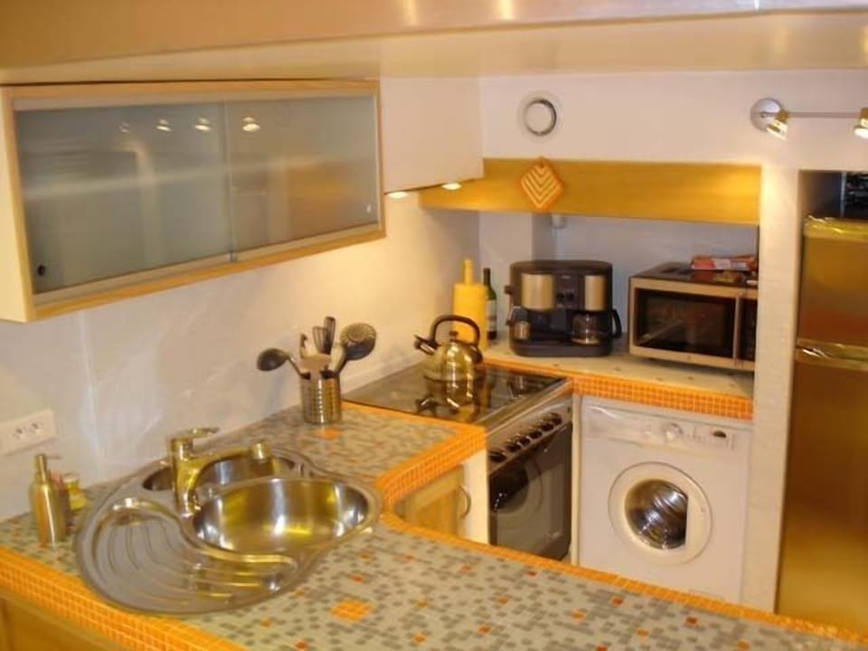 Dishwasher, clothes washer/dryer (combo), coffee maker, microwave, stove, fridge