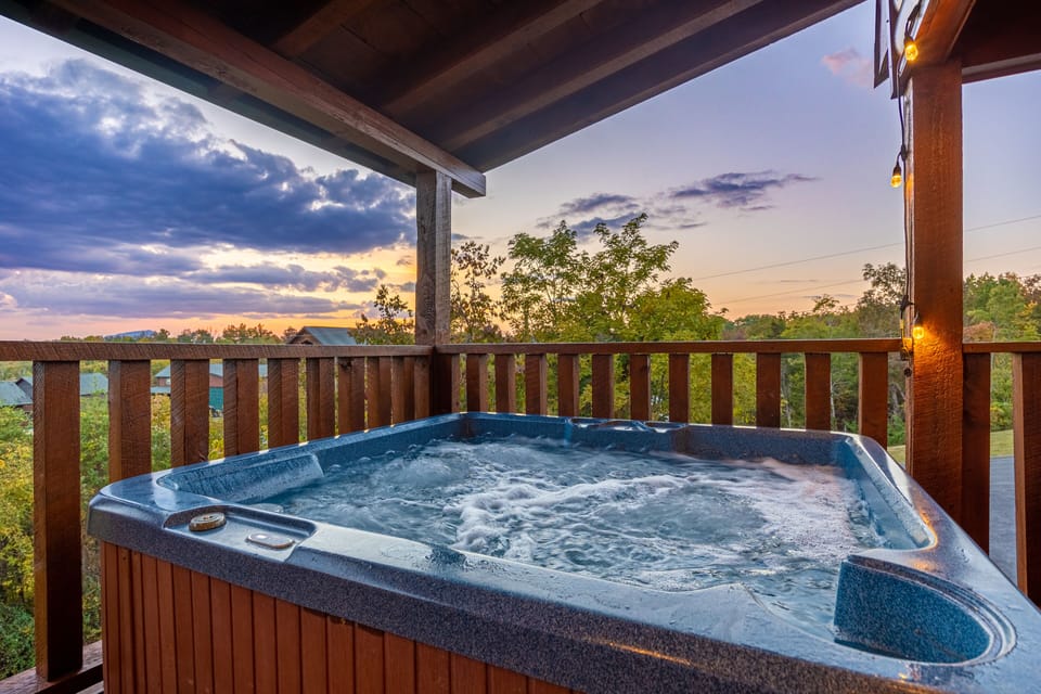 top level hot tub with a view of the mountains