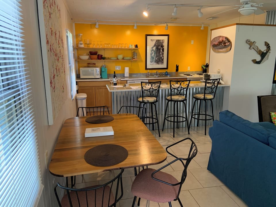 Living space with kitchen in the background. 