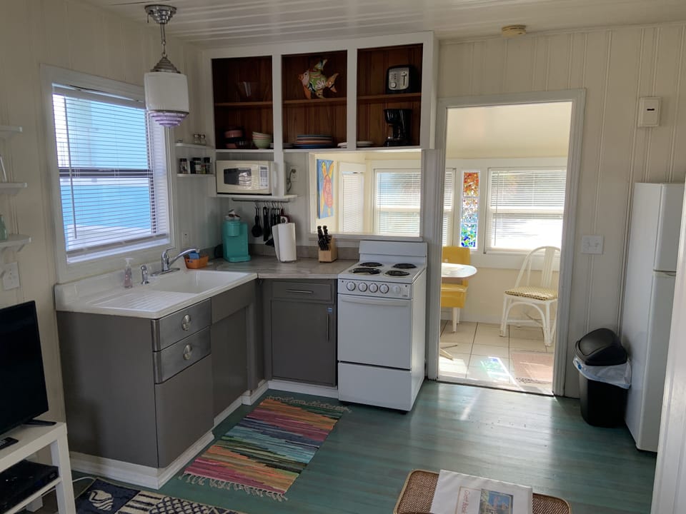 Kitchen with coffee maker, microwave, blender, toaster oven, etc.
