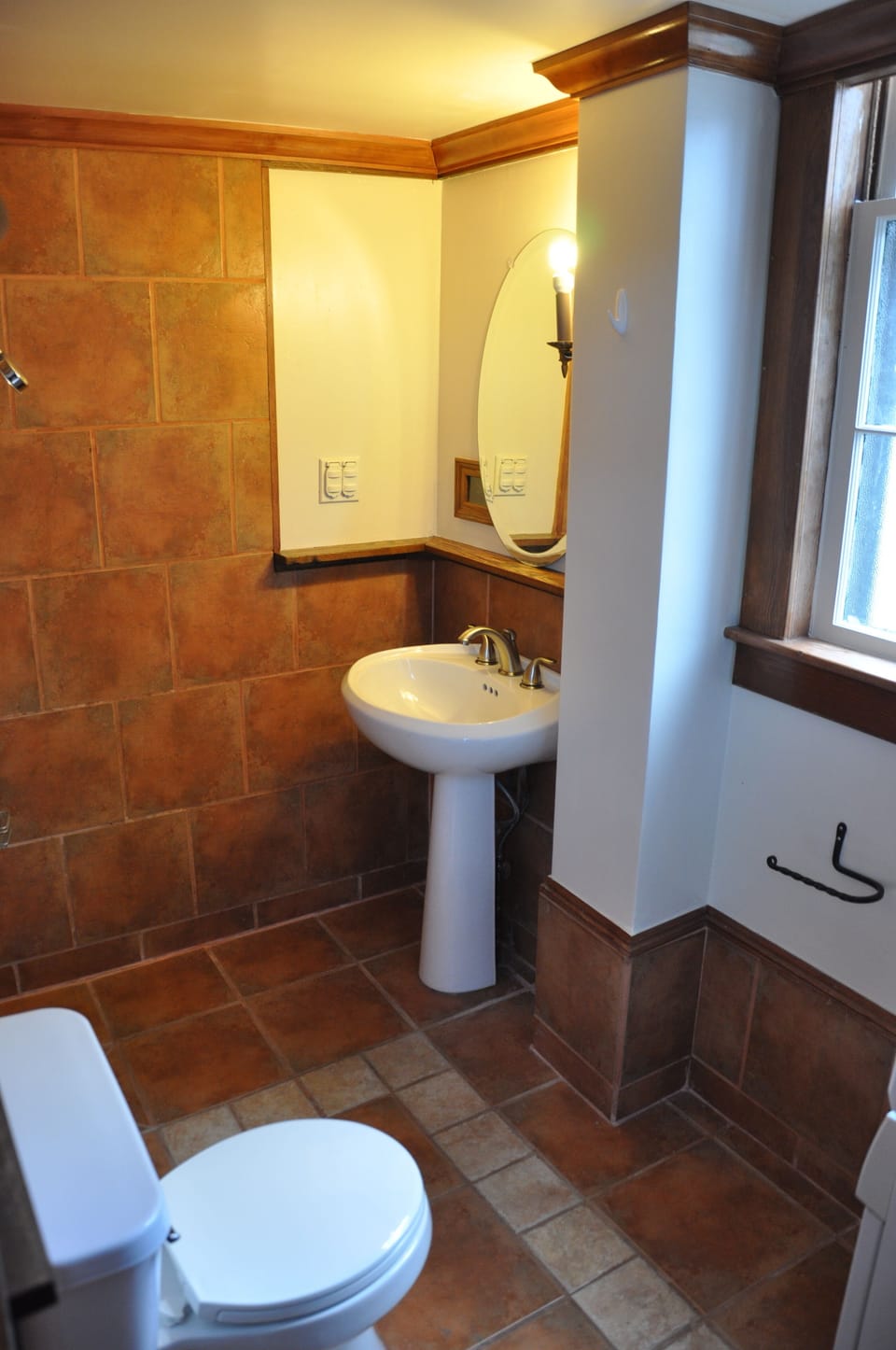 Downstairs full bath for two private rooms has European shower and laundry.