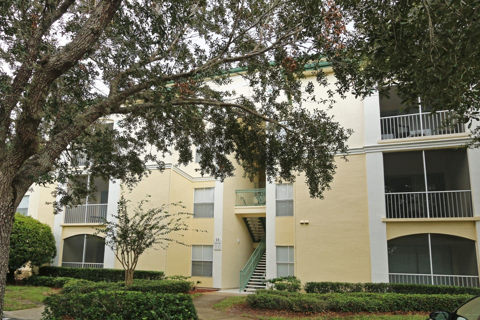 condo exterior.  Front entrance near basketball court