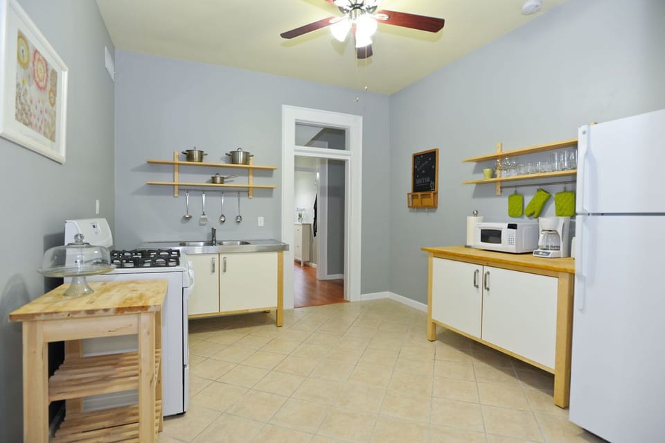 Kitchen with dining, pots, pans, plates