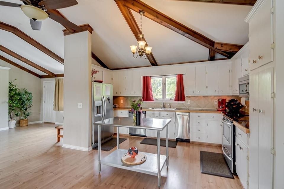 This open kitchen as part of the great room connects everyone to join the convo!