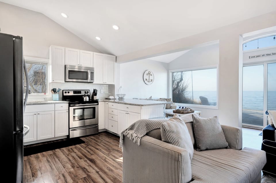 Kitchen with water views and deck access