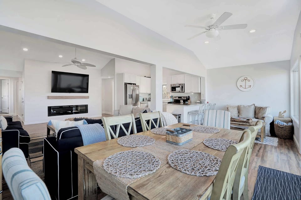 Dining for 8 with fireplace and open kitchen