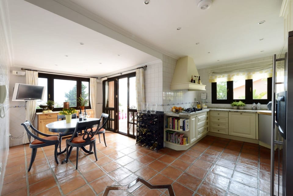 Kitchen with outside  terrace.