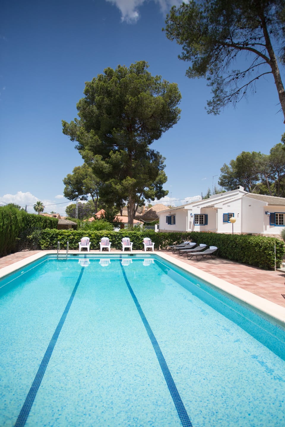 Large outdoor swimming pool, plenty of lounger and seating