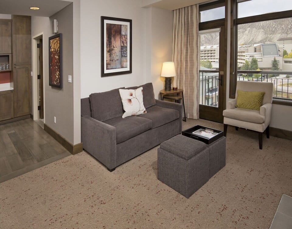 Private balcony with 2 chairs/table and mountain view. Sofa Sleeper