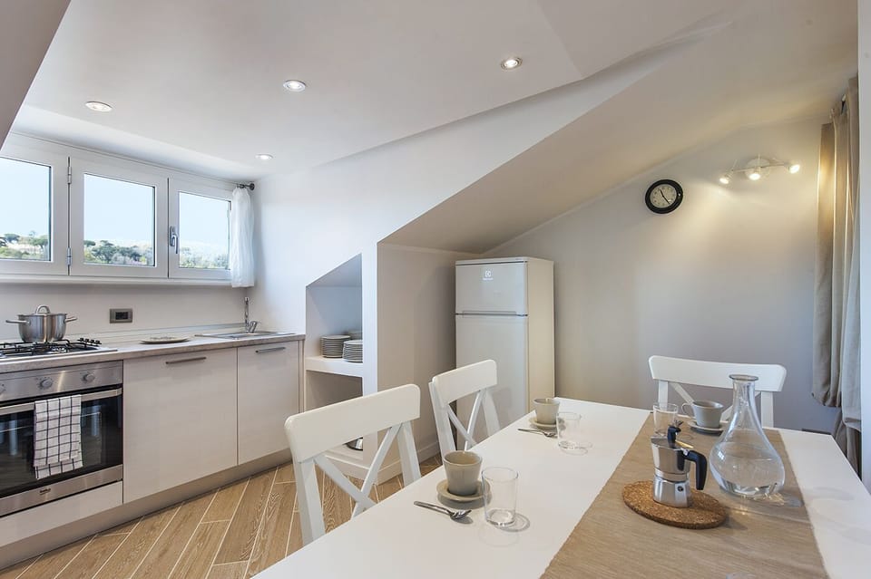 Dining area in the kitchen. Stove, Dishwasher and refrigerator