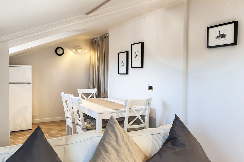 Dining area with table for 6. Refrigerator
