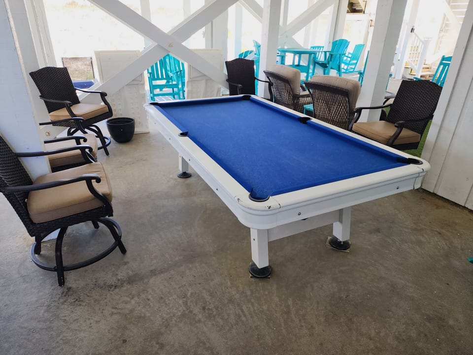 Outdoor pool table with comfortable chairs